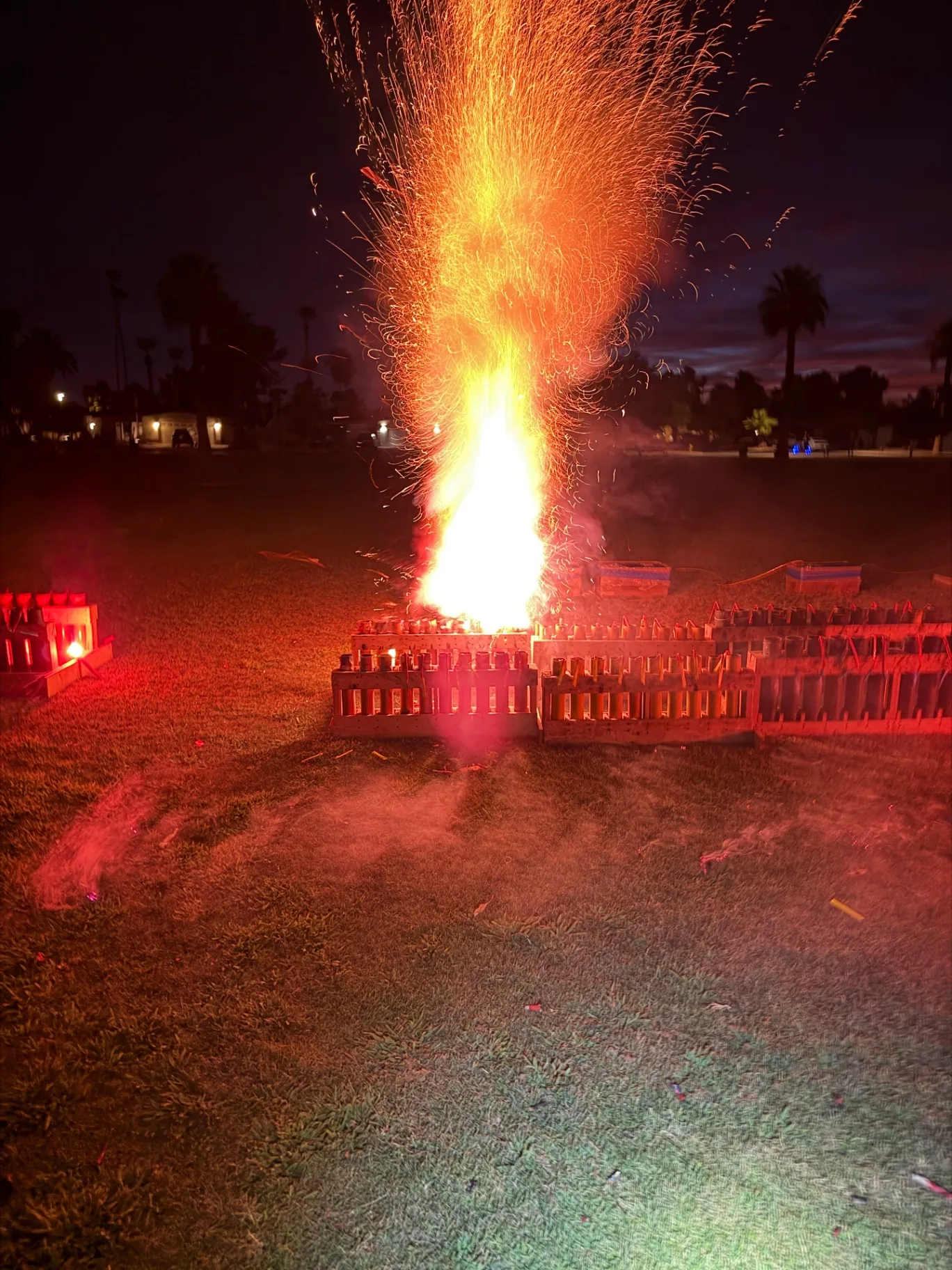 Aerial shell launching skyward from a 2.5 inch mortar rack at a professional fireworks display