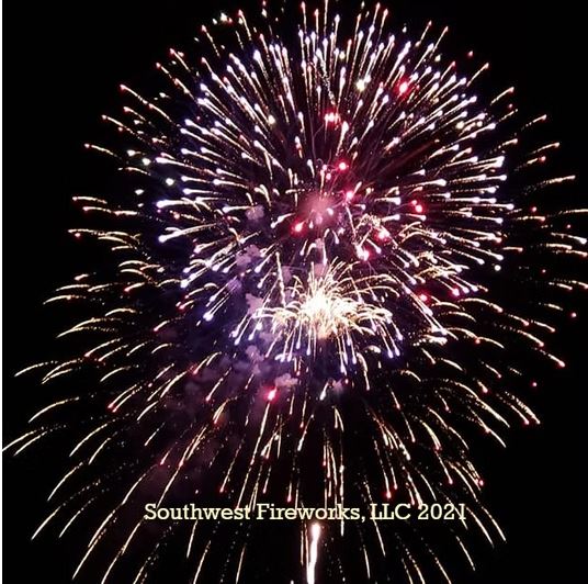 Massive layered finale fireworks shell filling the night sky with dense gold, red, and purple radial sparks